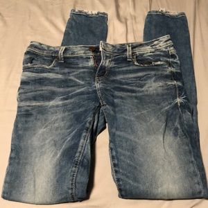 Buckle black skinny jeans